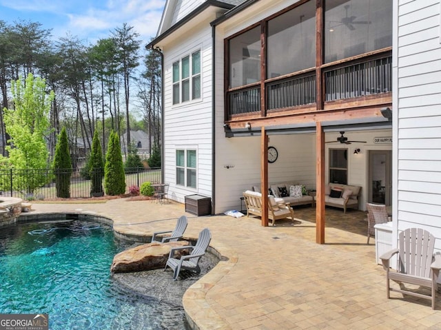 view of swimming pool featuring a patio area, an outdoor hangout area, fence, and a fenced in pool