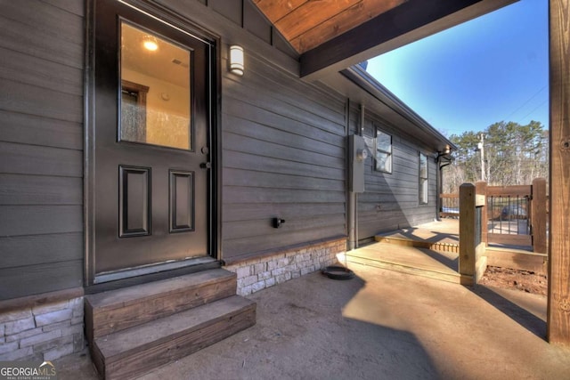doorway to property with a patio area