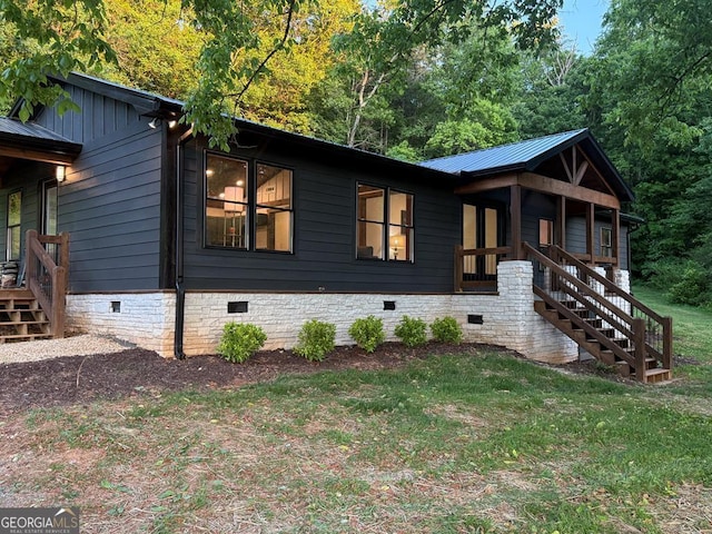 2380 Murphy Hwy, Mineral Bluff, GA 30559 - view of front facade with crawl space, stairs, a front lawn, and metal roof