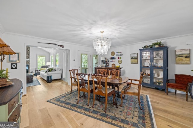 dining space featuring crown molding, a chandelier, light wood-style floors, baseboards, and recessed lighting