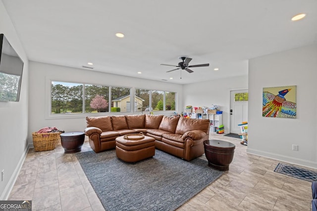 living area featuring a ceiling fan, recessed lighting, and baseboards