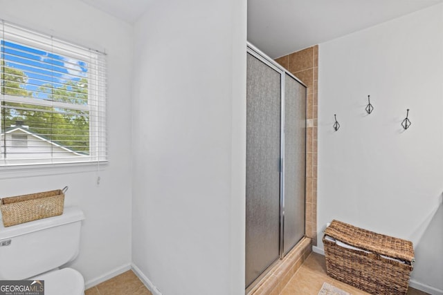 full bathroom featuring double vanity, an enclosed shower, and tile patterned flooring