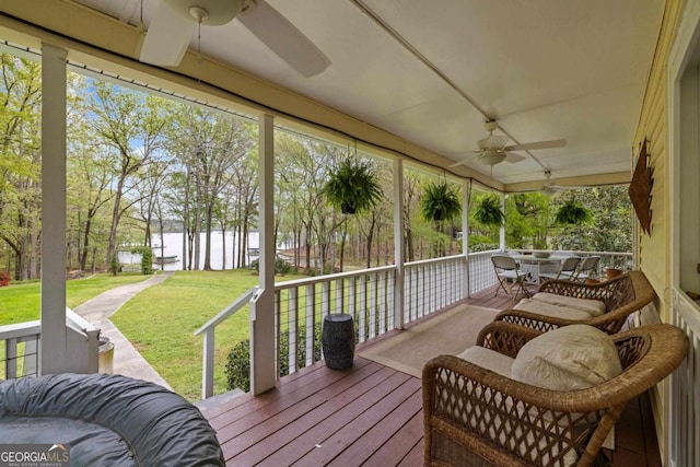 wooden deck featuring ceiling fan