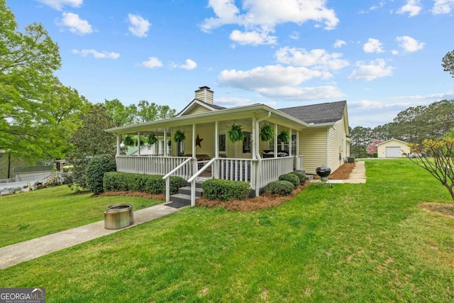 view of home's community with a water view and a yard