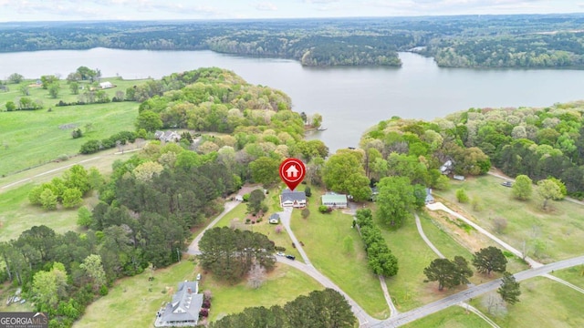 aerial view of a nearby body of water and a heavily wooded area