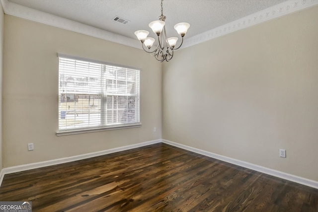 6793 Oconee Pl, Fairburn, GA 30213 - empty room featuring a chandelier, dark wood-style flooring, and a textured ceiling
