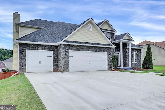 6793 Oconee Pl, Fairburn, GA 30213 - view of front facade with driveway, an attached garage, a chimney, a shingled roof, and stone siding