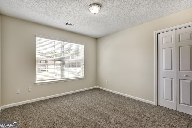 6793 Oconee Pl, Fairburn, GA 30213 - unfurnished room featuring carpet flooring and a textured ceiling