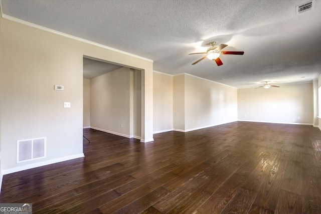 6793 Oconee Pl, Fairburn, GA 30213 - spare room featuring ceiling fan, ornamental molding, dark wood finished floors, and a textured ceiling