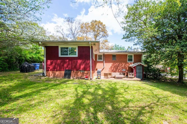 3614 Fairburn Pl NW, Atlanta, GA 30331 - back of property with a patio, brick siding, and a yard