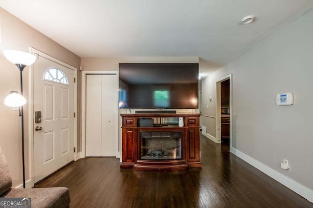 3614 Fairburn Pl NW, Atlanta, GA 30331 - living area with dark wood-type flooring, a fireplace, and baseboards