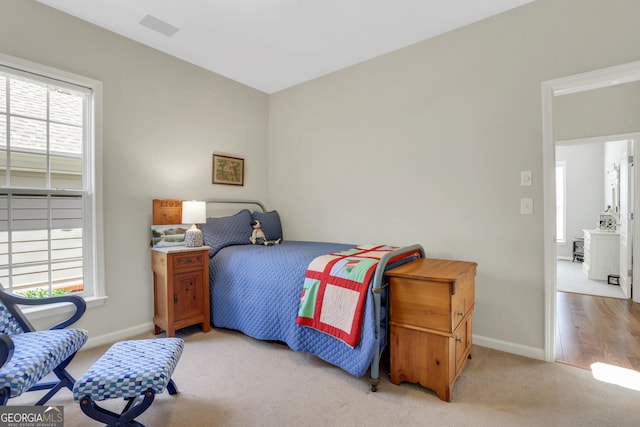 bedroom featuring carpet flooring, baseboards, and visible vents