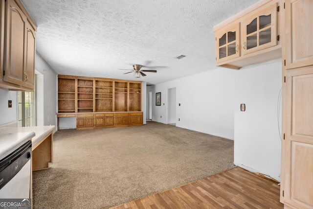 unfurnished room with visible vents, a notable chandelier, carpet floors, and a textured ceiling