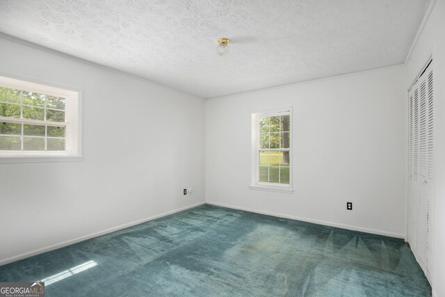 bathroom featuring a textured ceiling, shower / tub combo, toilet, ornamental molding, and vanity