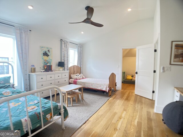 bedroom with recessed lighting, light wood finished floors, vaulted ceiling, and ceiling fan