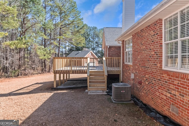 wooden deck with stairway and cooling unit