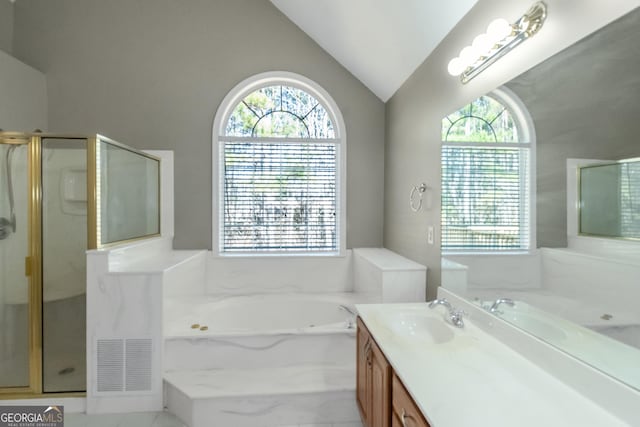 full bathroom with lofted ceiling, a garden tub, vanity, and a stall shower