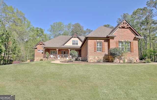 53 Gordon Manor Ct, Senoia, GA 30276 - craftsman house with a porch, a front lawn, brick siding, and board and batten siding