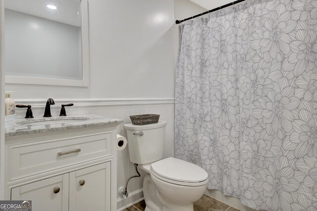 53 Gordon Manor Ct, Senoia, GA 30276 - full bathroom featuring vanity, a wainscoted wall, and curtained shower