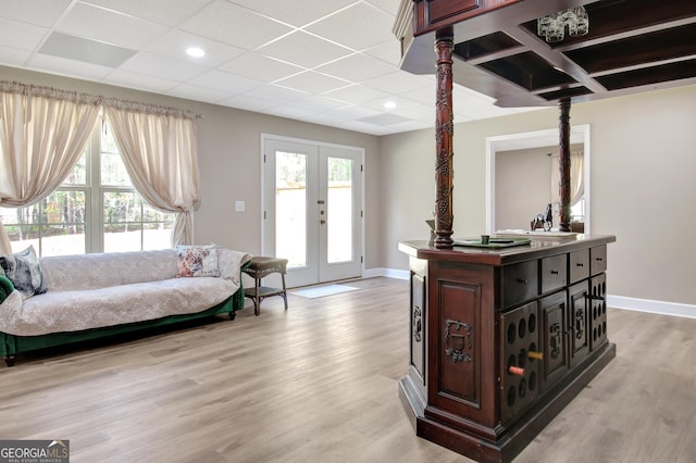 53 Gordon Manor Ct, Senoia, GA 30276 - living room with light wood finished floors, healthy amount of natural light, french doors, a paneled ceiling, and recessed lighting