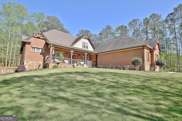 53 Gordon Manor Ct, Senoia, GA 30276 - view of front of property with a front yard, covered porch, and brick siding