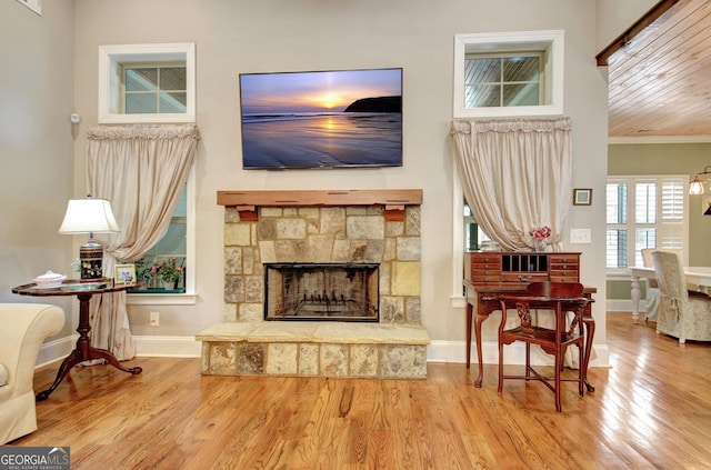 53 Gordon Manor Ct, Senoia, GA 30276 - living area featuring a fireplace, wood finished floors, and crown molding