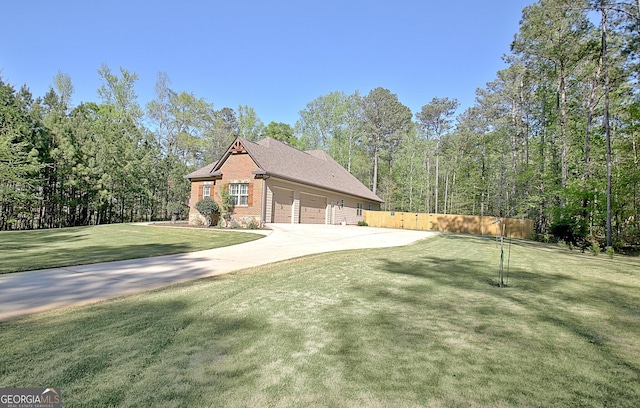53 Gordon Manor Ct, Senoia, GA 30276 - view of home's exterior featuring driveway, a garage, and brick siding