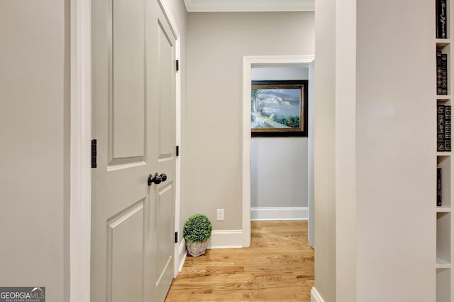 53 Gordon Manor Ct, Senoia, GA 30276 - corridor with light wood finished floors and crown molding