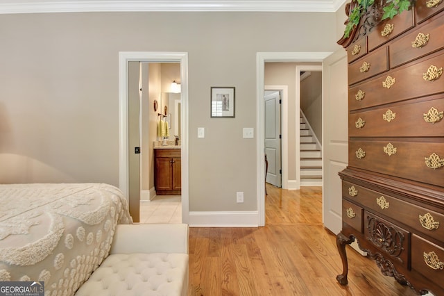 53 Gordon Manor Ct, Senoia, GA 30276 - bedroom featuring crown molding, light wood-style flooring, and connected bathroom