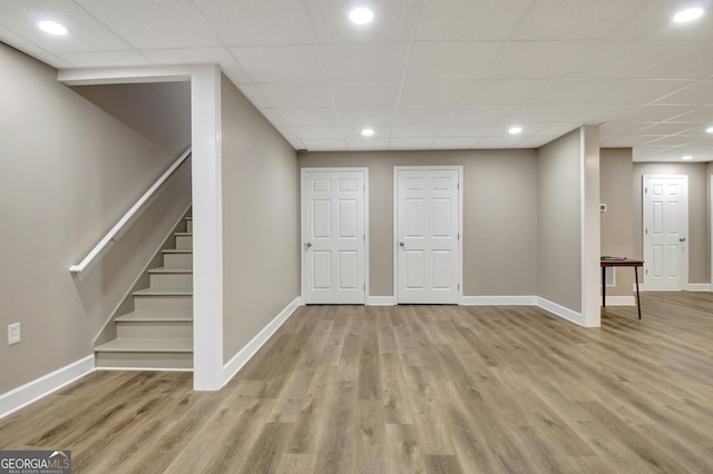 53 Gordon Manor Ct, Senoia, GA 30276 - finished basement featuring light wood-style floors, stairs, a paneled ceiling, and recessed lighting