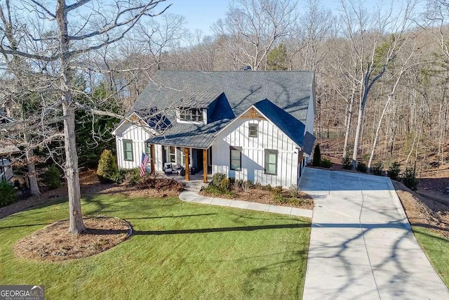 6014 Warpath Rd, Flowery Branch, GA 30542 - modern inspired farmhouse featuring board and batten siding, concrete driveway, covered porch, a front yard, and a shingled roof