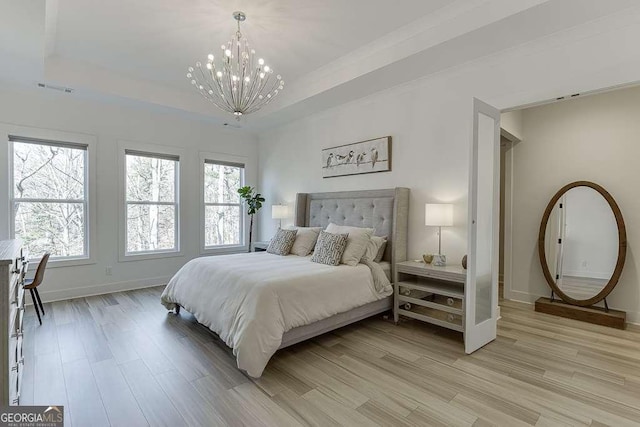 6014 Warpath Rd, Flowery Branch, GA 30542 - bedroom with light wood-style flooring, a chandelier, baseboards, and multiple windows