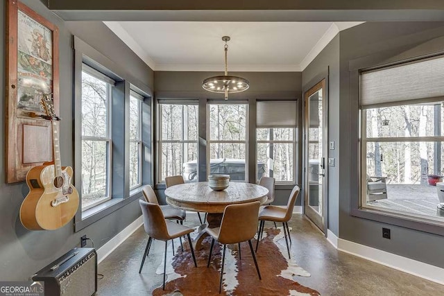 6014 Warpath Rd, Flowery Branch, GA 30542 - dining space with baseboards, healthy amount of natural light, finished concrete floors, and ornamental molding
