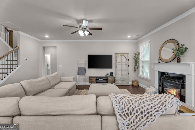 living room with recessed lighting, wood finished floors, a ceiling fan, baseboards, and stairs