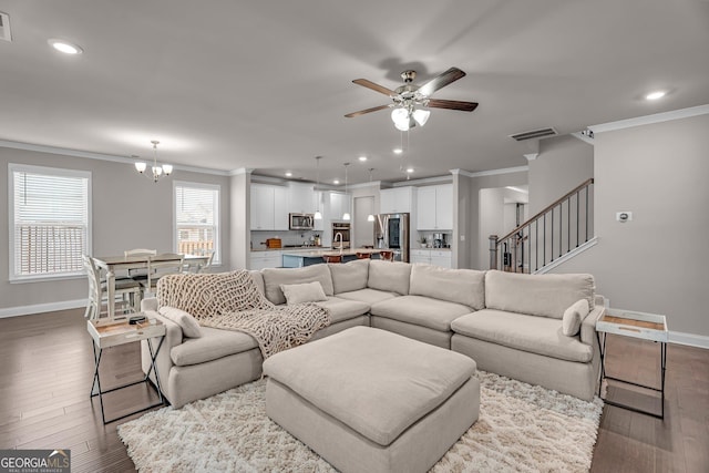 living area featuring crown molding, wood finished floors, baseboards, visible vents, and recessed lighting
