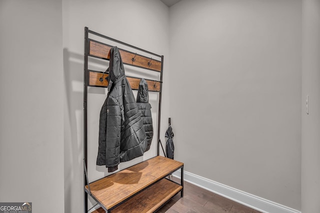 interior space with wood finished floors and baseboards