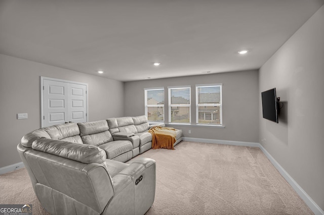 living room with light colored carpet, baseboards, and recessed lighting