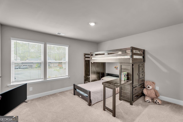 bedroom featuring carpet, visible vents, and baseboards