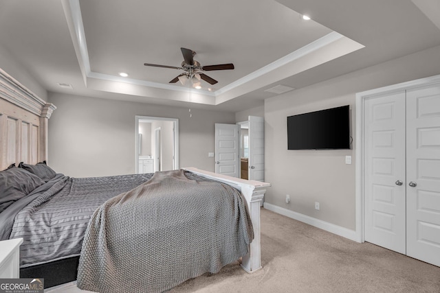 bedroom featuring recessed lighting, a raised ceiling, baseboards, and light carpet