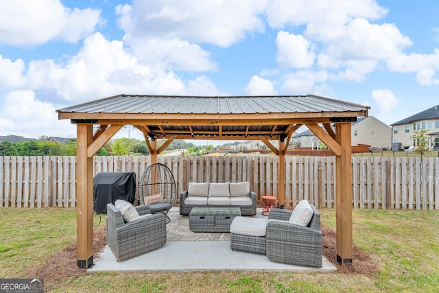 view of patio / terrace featuring a fenced backyard, an outdoor hangout area, a gazebo, and a grill