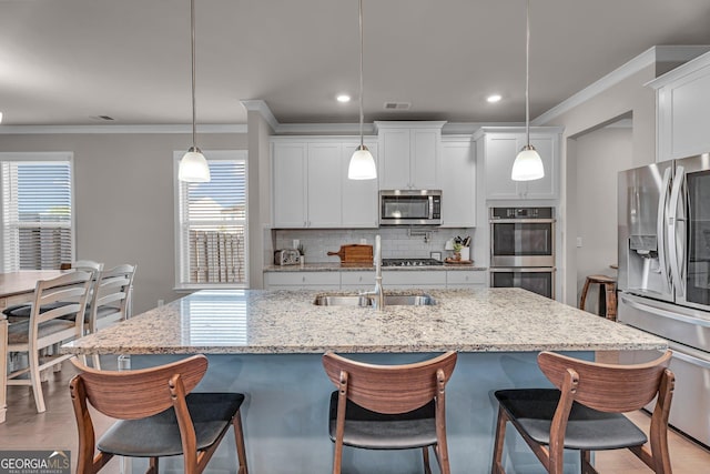 kitchen featuring visible vents, recessed lighting, backsplash, crown molding, and appliances with stainless steel finishes