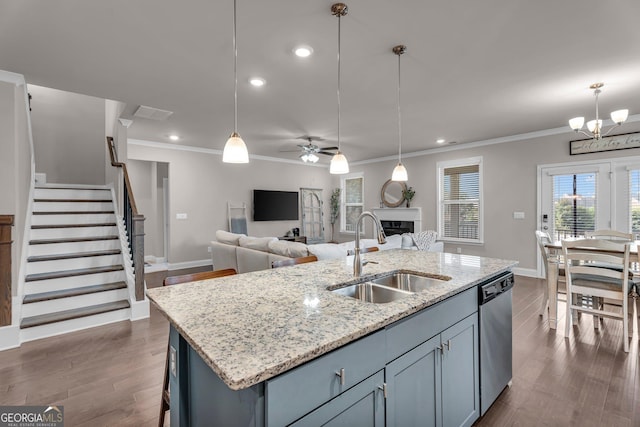 kitchen featuring ceiling fan with notable chandelier, dishwasher, a sink, and crown molding