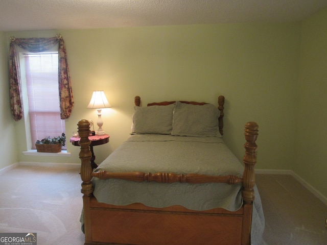 bedroom featuring carpet flooring and baseboards