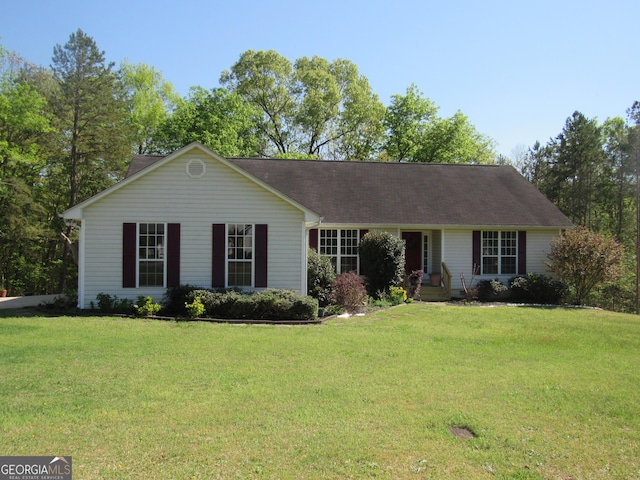 ranch-style house featuring a front lawn