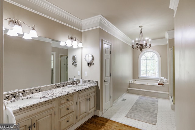full bathroom with ornamental molding, a stall shower, a sink, and a chandelier