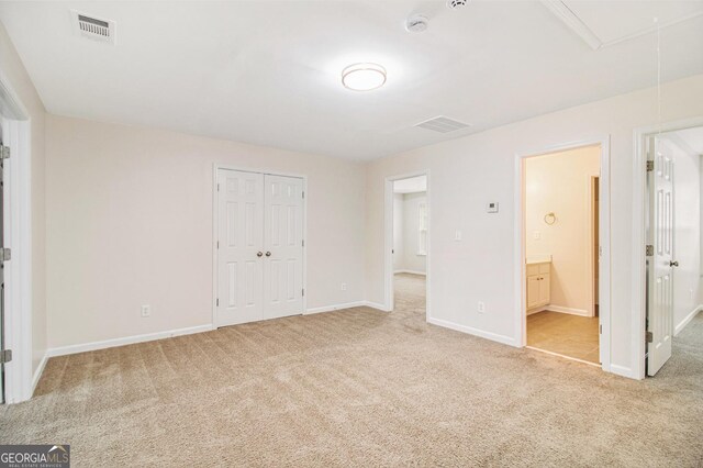 2036 Broadmoor Way, Fairburn, GA 30213 - unfurnished bedroom featuring carpet, baseboards, visible vents, and attic access