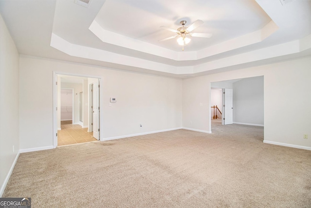 2036 Broadmoor Way, Fairburn, GA 30213 - empty room featuring a ceiling fan, light carpet, a raised ceiling, baseboards, and visible vents