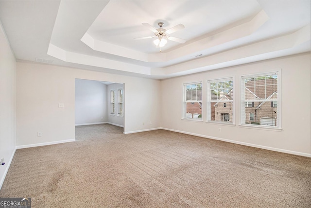 2036 Broadmoor Way, Fairburn, GA 30213 - empty room with baseboards, a raised ceiling, carpet floors, visible vents, and a ceiling fan