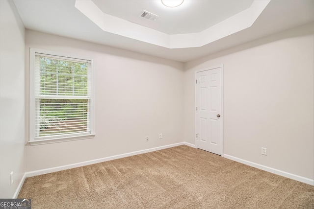 2036 Broadmoor Way, Fairburn, GA 30213 - unfurnished room with carpet flooring, a tray ceiling, baseboards, and visible vents