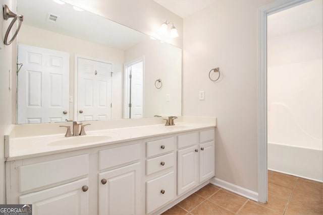 2036 Broadmoor Way, Fairburn, GA 30213 - full bath featuring tile patterned floors, a sink, double vanity, and visible vents